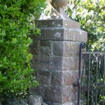 Gate Post, Part Of Wall And Hedge At The Entrance To Drummond Lodge.