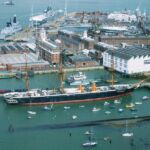 HMS Warrior with HMS Dragon and one of the aircraft carriers being mothballed